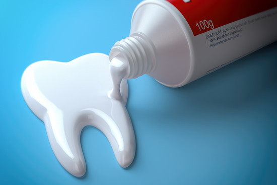 Toothpaste on a glossy tooth