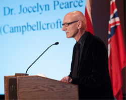 Dr. Steven Levinson speaking at a podium